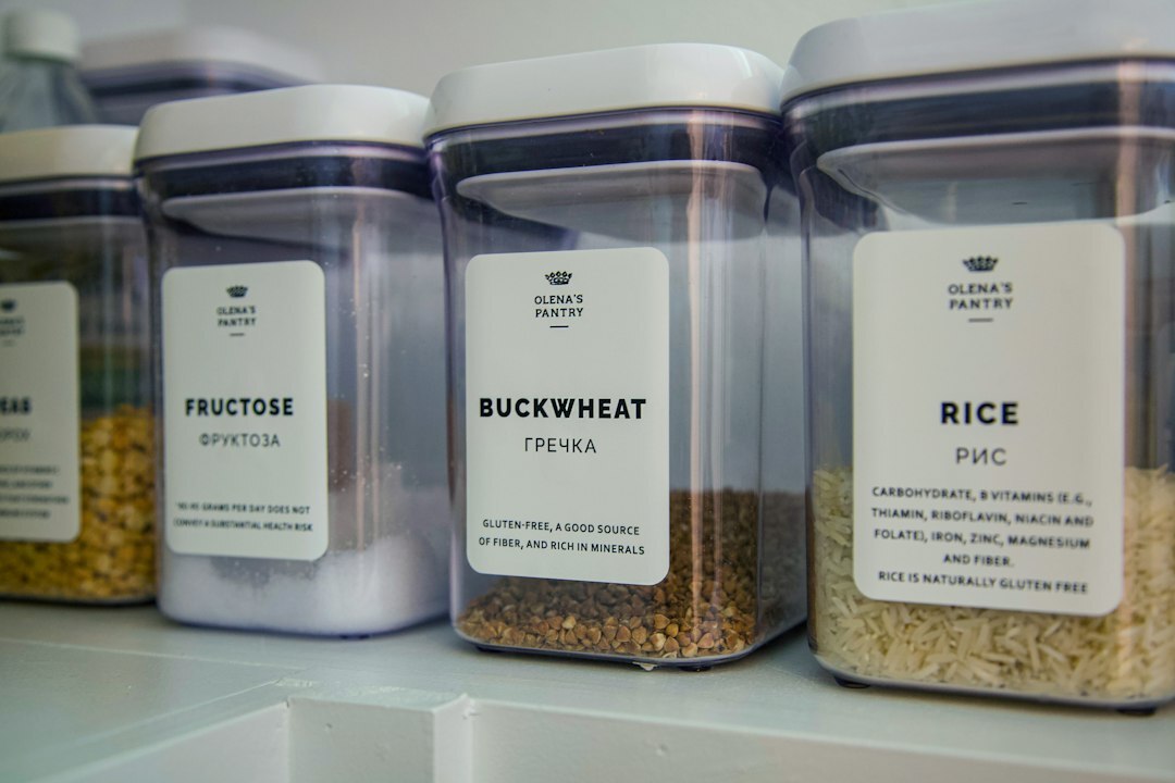 Organized kitchen pantry with labeled jars and containers