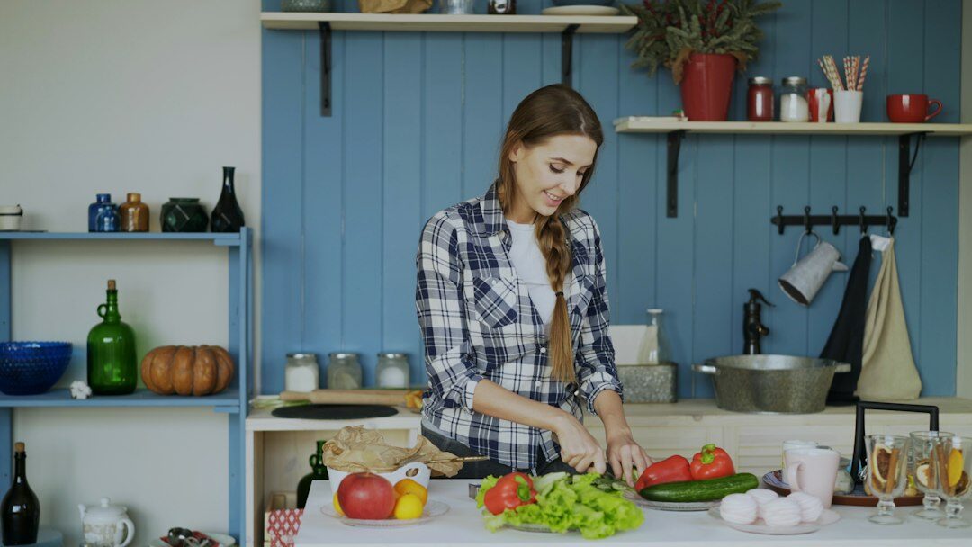 woman cleaning kitchen counter